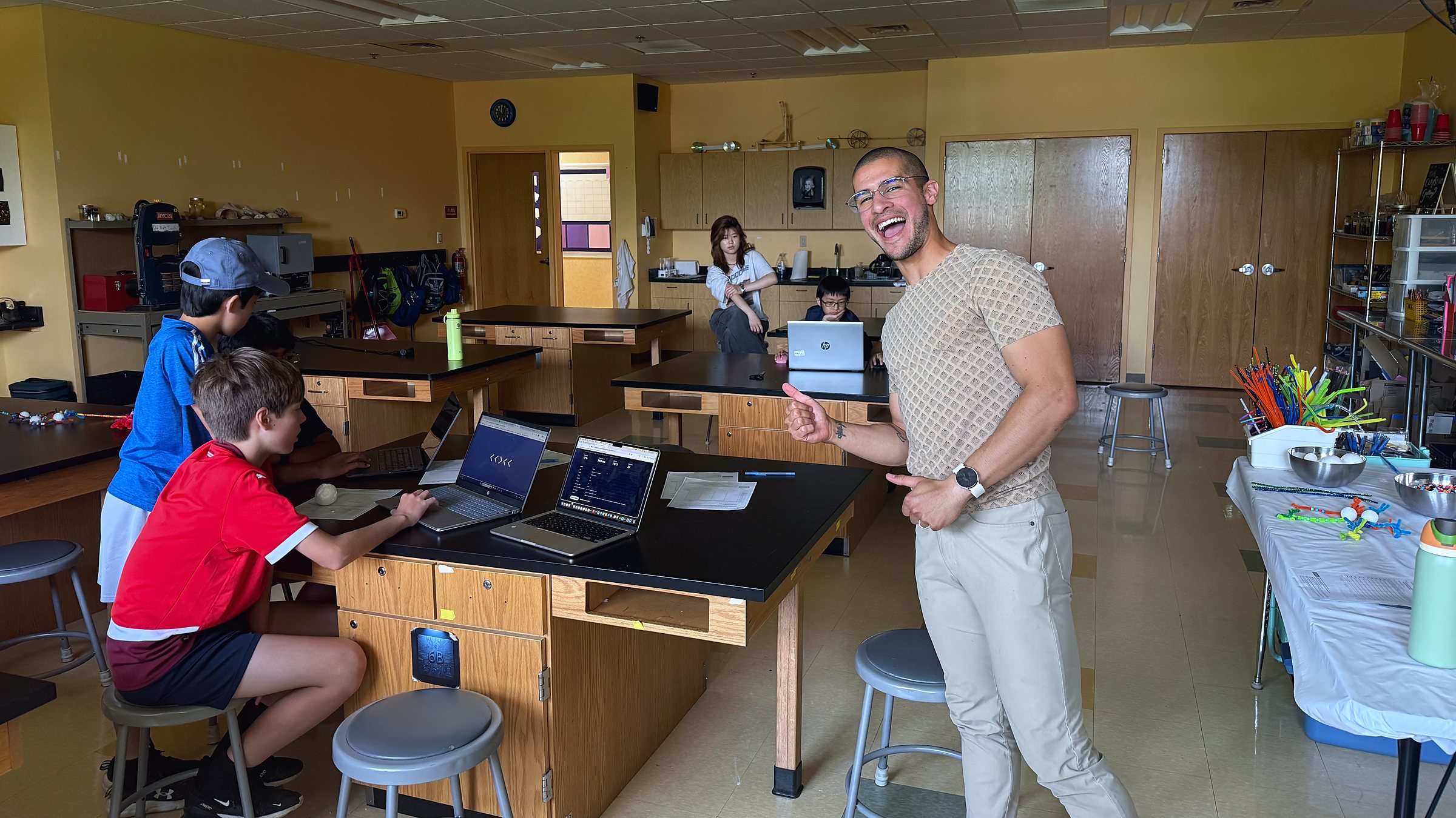 Guest instructor Jonathan Cerna laughs mid-lesson while students work at their laptops