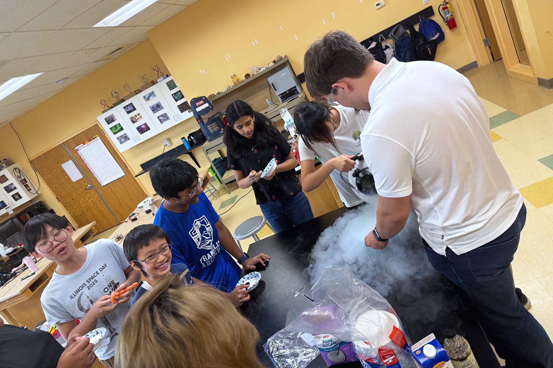 A guest scientist's demo fills the table with fog during Technology Hour